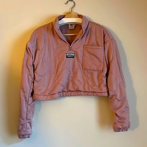 Adidas pink crop sweatshirt with hexagon stitching.